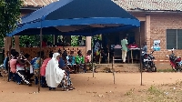 Photo of some would be voters waiting in queue to be registered.
