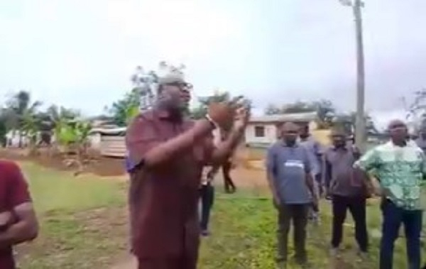 Dr Randy Abbey (with hands raised) fuming at the Sefwi Boako cocoa station