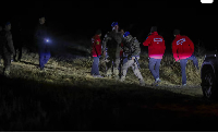 Turkish security forces and search and rescue teams work around the crash site