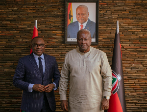 French Ambassador to Ghana, Jules Armand Aniambossou [L] and President-elect of Ghana, John Mahama