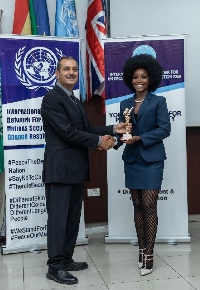 Zino Lexili Ogazi receiving an award at the Honourary Title Award ceremony