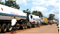 Oil tankers delivering fuel to Uganda queue at Busia Kenya border