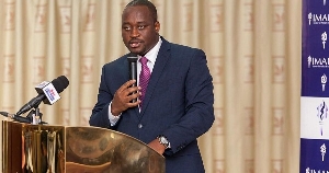 Dr. Theo Acheampong, Economist and Political Risk Analyst