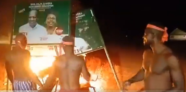 The youth setting the billboards on fire