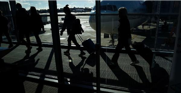 Passengers make their way through the terminal at Washington Dulles International Airport