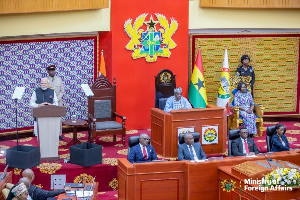 The framed Kente behind the Speaker of Parliament were gifted by the Asantehene