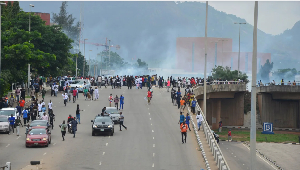 Police fire tear gas during a protest against Nigeria's cost-of-living crisis in Abuja on Aug. 1, 20