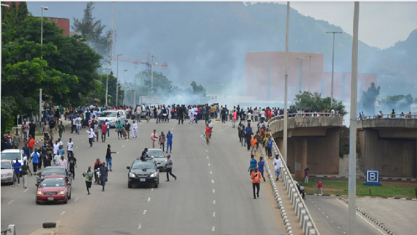 Police fire tear gas during a protest against Nigeria's cost-of-living crisis in Abuja on Aug. 1, 20