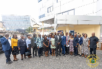 Finance Minister Dr Ato Forson with the staff of the Osu Tax Service Centre
