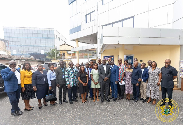 Finance Minister Dr Ato Forson with the staff of the Osu Tax Service Centre