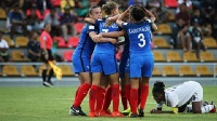 France celebrate while a Ghanaian player goes down on her knees in disappointment