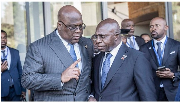 DR Congo President Felix Tshisekedi (left) talks with Angola's Foreign Minister Tete Antonio