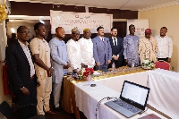 Country Director of Qatar Charity in a group picture