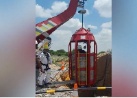 A cage being lowered down from the top of the disused shaft to bring the miners back to the surface