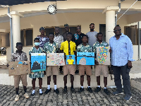 A group photograph with teachers and students of participating schools. First Right – Paul Awentami