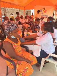 Residents of a community undergoing medical screening