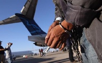 The illegal immigrants deported were in handcuffs