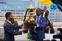 Emmanuel Kofi Nti, General Commissioner of GRA with the trophy